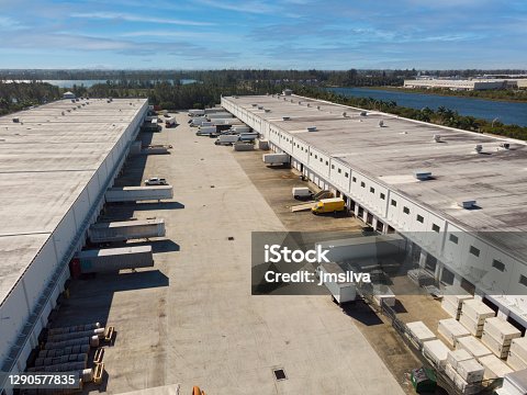 istock Distribution warehouse with trucks of different capacity 1290577835