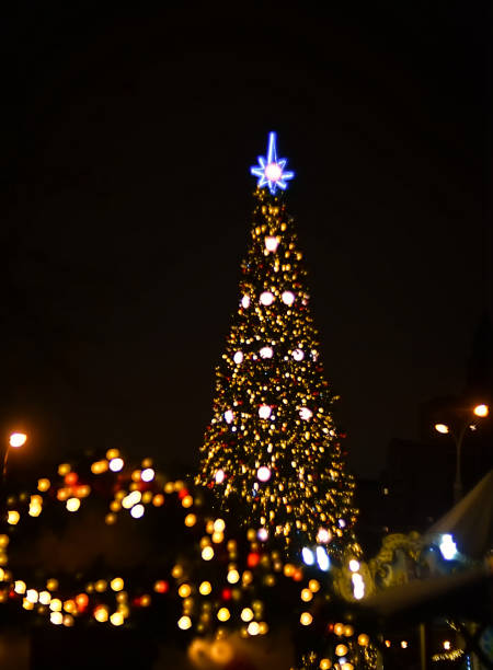 istock Christmas tree made of bokeh. christmas background 1290577959
