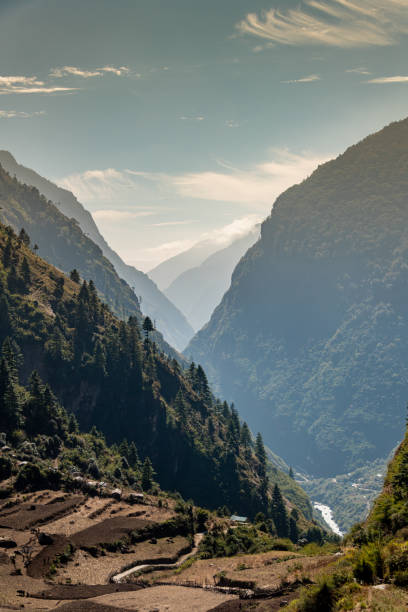 istock Vertical photo of a Himalayan Valley with setting sun - Nepal. 1290578026