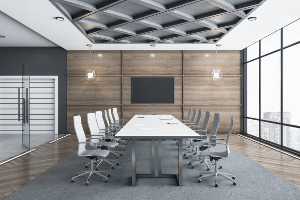 istock Meeting room interior with empty tv screen 1290582628