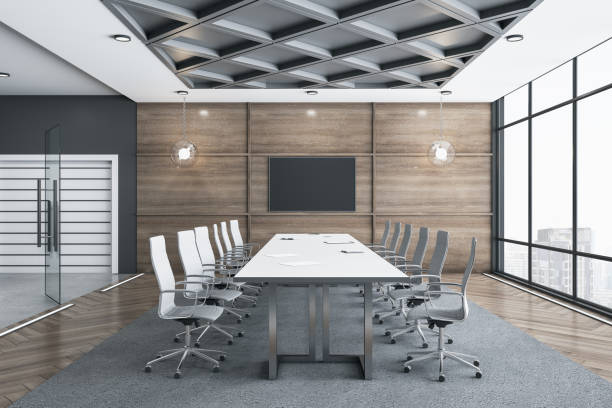 Meeting room interior with empty tv screen Meeting room interior with empty tv screen and panoramic city view with sunlight. 3D Rendering meeting room stock pictures, royalty-free photos & images