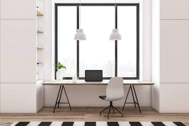 istock Modern workplace with laptop on table in home office 1290582639