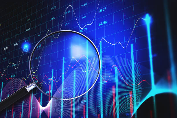 istock Magnifying glass with stock chart on cirtual screen. 1290582686