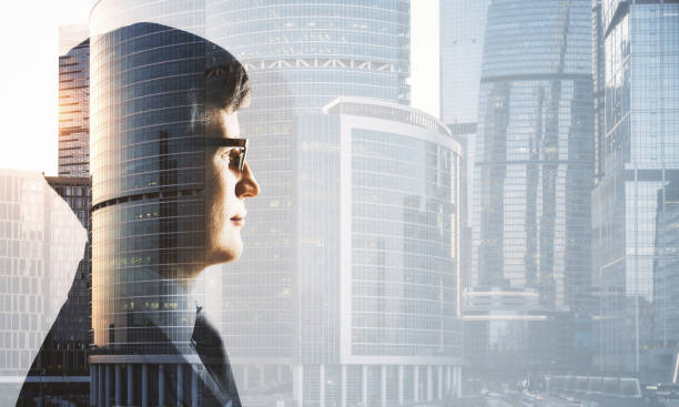 istock Silhouette businessman hand on city background. 1290582747