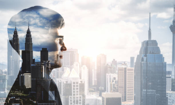 istock Young businessman on city background 1290582889