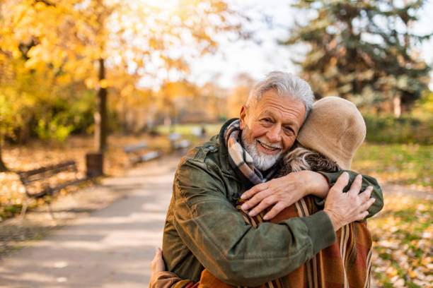 istock Happy senior man embracing his unrecognizable wife. 1290583030
