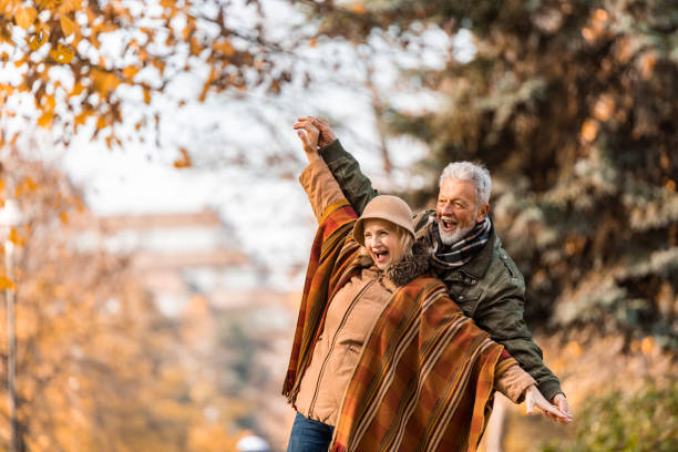 istock Loving senior couple having fun in the park. 1290583099