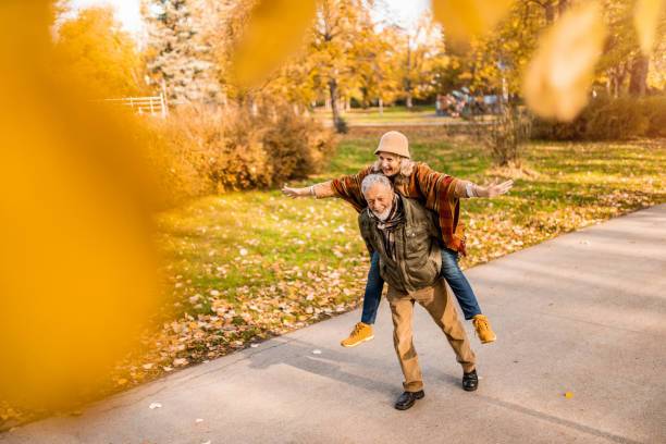 istock Loving senior couple having fun in the park. 1290583651
