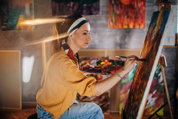 istock One beautiful female painter painting at home atelier 1290583685