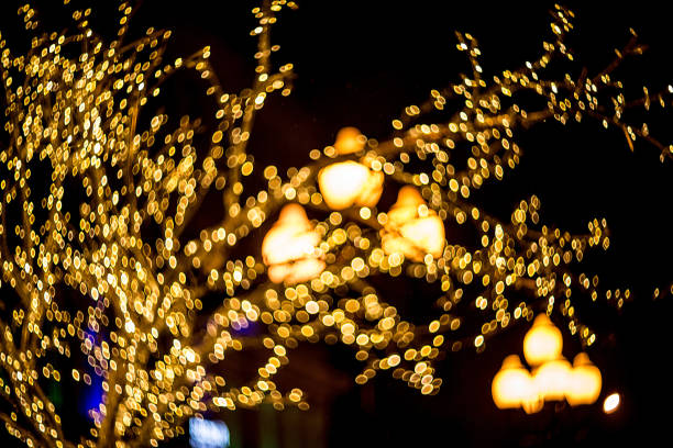 istock bokeh in the form of a  Christmas tree on a black background 1290583722