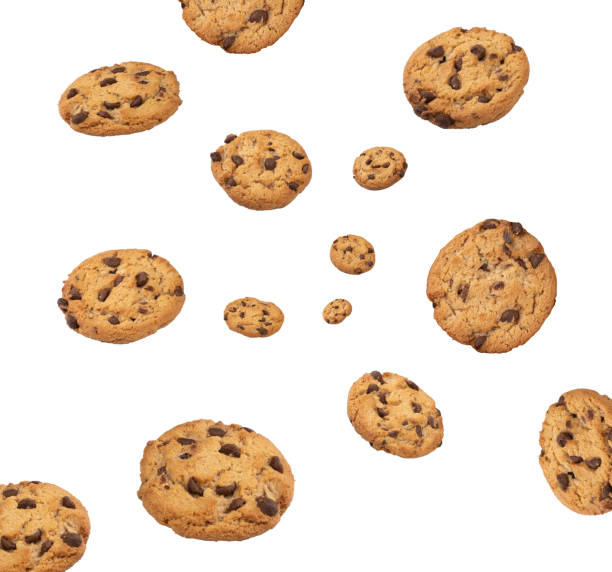 istock Chocolate chip cookies droping isolated over white background 1290583908