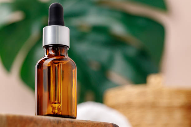 istock Cosmetic dark amber glass bottle with pipette 1290584111