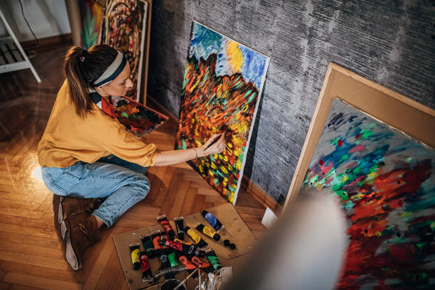 istock One talented female painter painting on canvas at home atelier 1290587145
