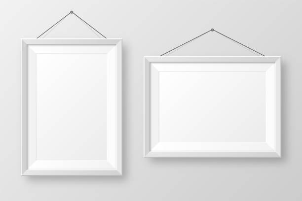 istock Realistic hanging on a wall blank white picture frame with shadow. Modern poster mockup isolated on gray background. Empty photo frame for art gallery or interior. Vector illustration 1290589774