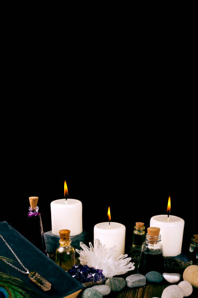 istock Magic potion, book, crystals, stones and candles 1290590563