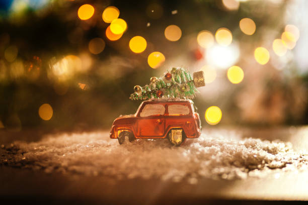 istock Decorated retro red car with festive New Year lights 1290593602