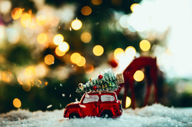 istock Decorated retro red car with festive New Year lights 1290594556