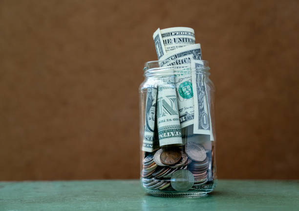 istock US dollars in the jar Saving money concept 1290595604