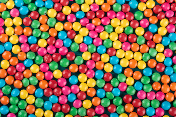 istock Colorful Confetti candy background texture top view. 1290598239
