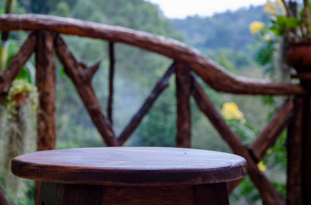 istock Empty brown and grunge wood of table panel with green forest background 1290599055
