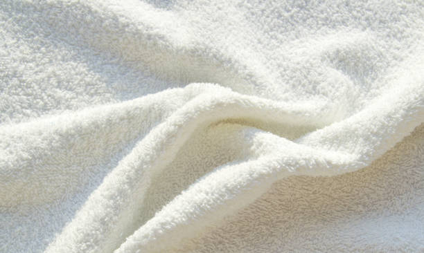 istock White Terry bath towel, texture with pleats, background 1290599928