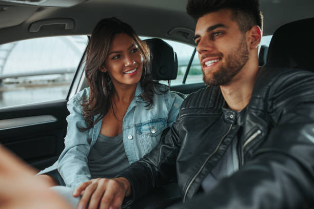 istock Young happy couple going on a road trip by car 1290600020