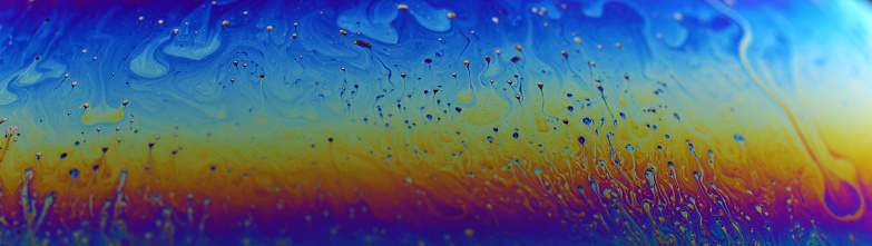 Abstract colorful liquid background.Macro shot of a soap bubble