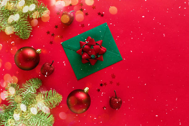 istock Christmas letter with greeting card and congratulations, christmas tree branches, baubles, glitter decorations on red. Merry Christmas happy New Year concept. Flat lay, banner, copy space 1290613962