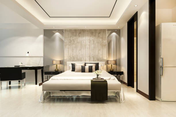 istock 3d rendering beautiful luxury bedroom suite in hotel with working table near bathroom 1290619626