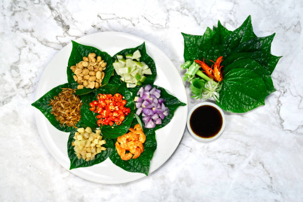 Savoury Leaf Wraps (Miang Kham) stock photo