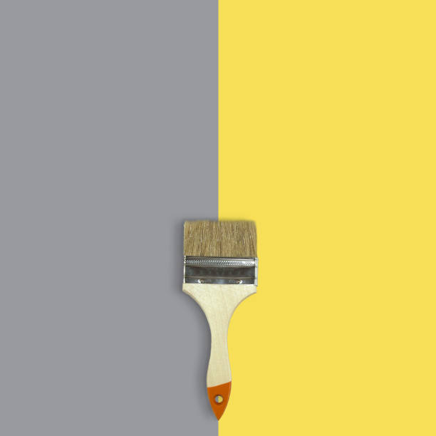 istock Brush on yellow and grey background 1290633535