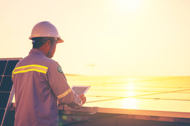 istock A male engineer holds a tablet to inspect the solar cell system. 1290639888