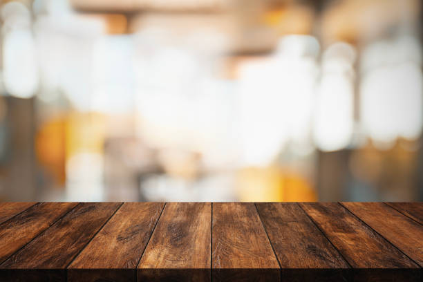 istock Wood table with blur interior coffee shop or cafe for background. 1290639924