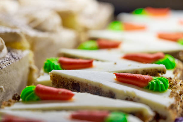 Carrot cake with chocolate topping on a table.