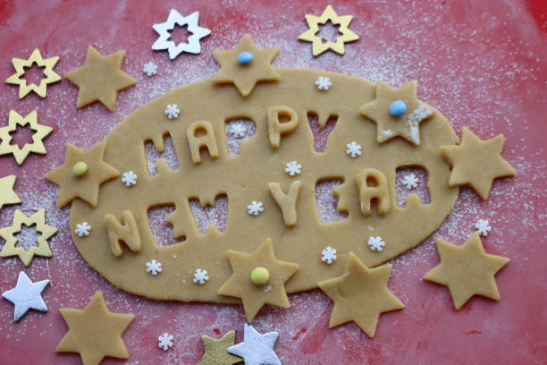istock Happy New year.Cookie dough letters on wooden table 1290641866