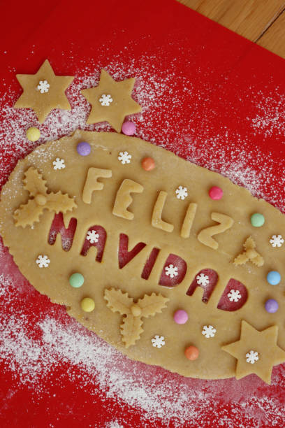 istock Feliz Navidad.Cookie dough letters on wooden table 1290641876