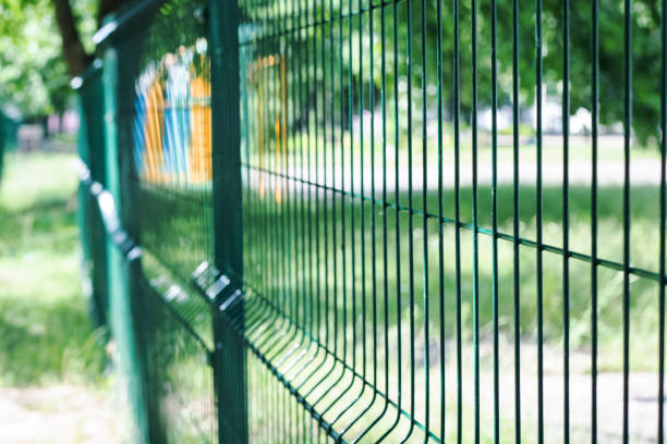 istock A blue mesh fence close up in summer 1290644145