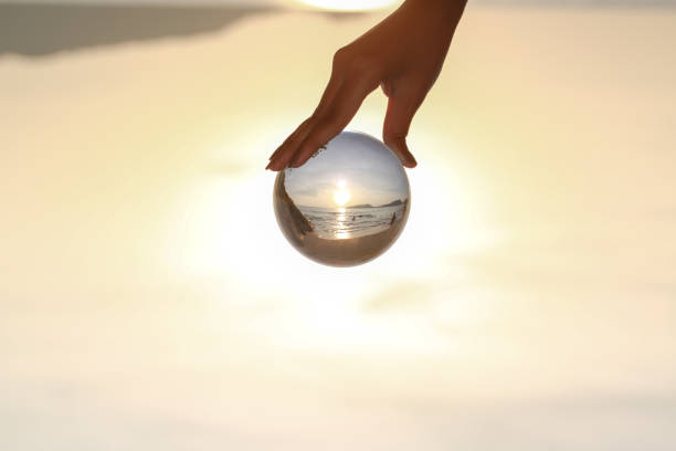 istock Catch the crystal ball with her finger 1290645801