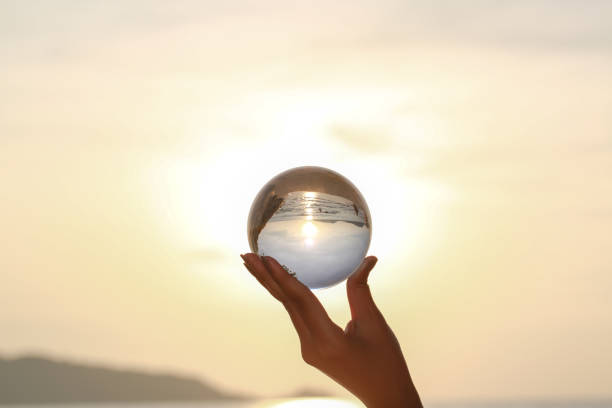 istock Catch the crystal ball with her finger 1290645806