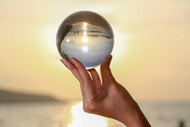 istock Catch the crystal ball with her finger 1290645809