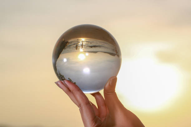 istock Catch the crystal ball with her finger 1290645815