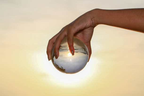istock Catch the crystal ball with her finger 1290645821