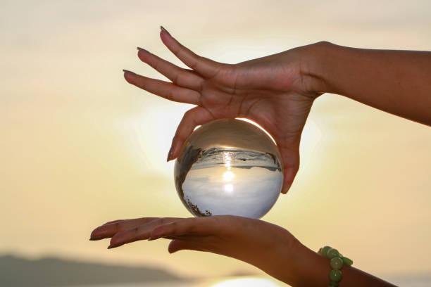 istock Catch the crystal ball with her finger 1290645832