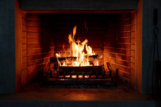 istock Fireplace, fire burning, cozy warm fireside, christmas home. 1290648234