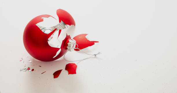 istock Red Christmas ball broken isolated on white background, closeup view 1290648263