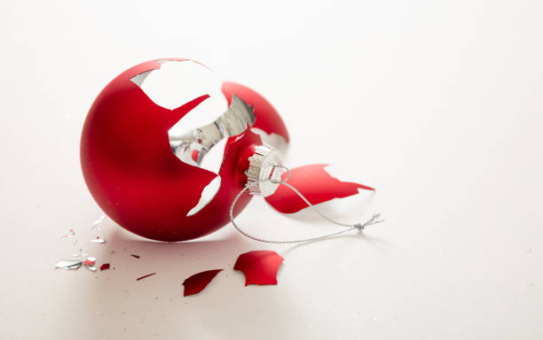 istock Red Christmas ball broken isolated on white background, closeup view 1290648266