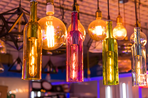 Decorative beer bottle style diode light bulb hang from ceiling