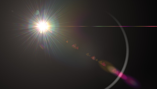 Lens Flare.Light over black background. Abstract sun burst with digital lens flare background. Gleams rounded shapes