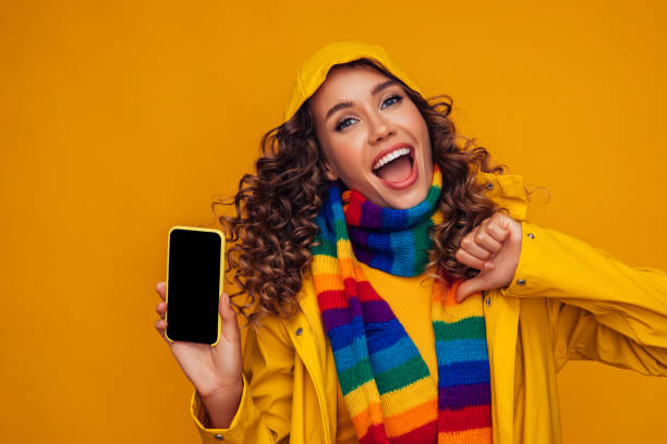 istock Beautiful woman with smartphone gesturing 1290648932