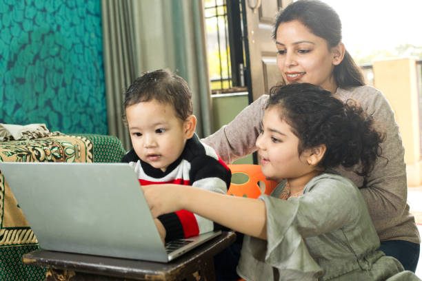 istock Happy family using laptop at home 1290649685